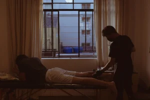 a man sitting on a bed